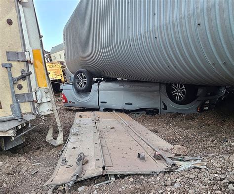 23 freight cars, new vehicles heavily damaged in train derailment in northern Arizona